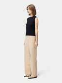 Women's Cashmere Silk Sleeveless Top Black worn by model, side view on white backround