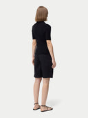 Cashmere Silk Women's Polo Shirt Black   worn by model, back view on white background