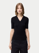 Cashmere Silk Women's Polo Shirt Black   worn by model, detail view on white background