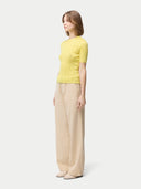 Women's Lace-Knit Cashmere Silk Top Blazzing Yellow worn by model, side view on white backround