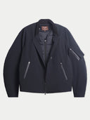 Flat lay of the CashmereTech bomber jacket in black, opened to show the quilted inner jacket layered inside.