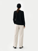 € 99 Cashmere Hat & Sweater Set Black worn by model, back view on white background