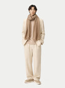 Organic Colour Cashmere Lightweight Woven Scarf Taupe worn by model, detail view on white background