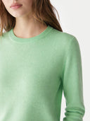 Women's Green Ash Cashmere Crewneck Sweater worn by model, detail view on white background
