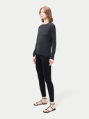 Women's Silk Cashmere Leggings Black worn by model, side view on white background