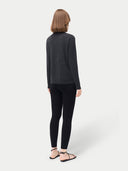 Women's Silk Cashmere Leggings Black worn by model, back view on white background