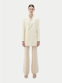 Women's White single-breasted cashmere blazer worn by model, front view on white background