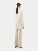 Women's White single-breasted cashmere blazer worn by model, back view on white background