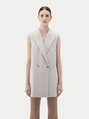 Close front view of wind chime vest showing notch lapel and two gold-tone buttons
