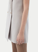 Detail of button closure, hem and armhole on the wind chime vest