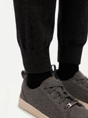 Women's Cashmere Cuffed Jogger Charcoal worn by model, detail view on white background