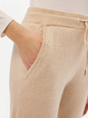 Women's Cashmere Cuffed Jogger Beige  worn by model, side view on white background