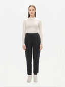 A pair of charcoal women's cashmere joggers with a ribbed hem and elastic waistband. #color_charcoal