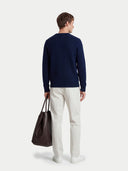 Men's Navy Cashmere Cable-Knit Sweater worn by model, back view on white background #color_navy-blue