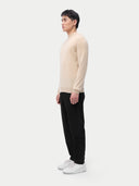 Cashmere Mock Neck Pullover Beige Taupe worn by model, side view, on white background
