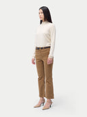 Women's Cashmere Mock Neck Sweater Off White worn by model, side view, on white background