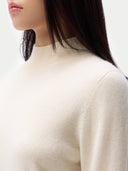 Women's Cashmere Mock Neck Sweater Off White worn by model, detail view, on white background