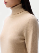 Cashmere Turtleneck Sweater Beige worn by model, detail view, on white background