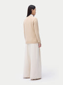 Cashmere Full-Zip Cardigan Beige worn by model, back view, on white background
