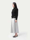 Essential Cashmere Mock Neck Sweater Black worn by model, side view, on white background