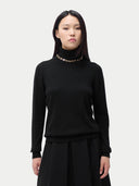 Cashmere Turtleneck Sweater Black worn by model, detail view, on white background