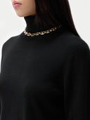 Cashmere Turtleneck Sweater Black worn by model, detail view, on white background