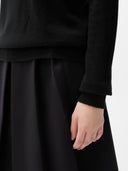 Cashmere Turtleneck Sweater Black worn by model, detail view, on white background