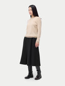 Cashmere Crewneck Sweater Beige worn by model, side view, on white background