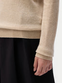 Cashmere Crewneck Sweater Beige worn by model, detail view, on white background