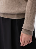 Cashmere Crewneck Sweater Taupe worn by model, detail view, on white background