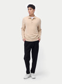 Men’s beige cashmere polo sweater worn by model, front view on white background