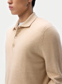 Men‚Äôs beige cashmere polo sweater worn by model, detail view on white background #color_beige