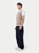 Men’s taupe cashmere vest worn by model, side view, on white background