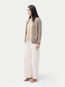 Cashmere Crew Neck Button Cardigan Taupe worn by model, side view, on white background