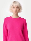 Women's Magenta Pink Cashmere Crewneck Sweater worn by model, detail view on white background 