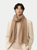 Organic Colour Cashmere Lightweight Woven Scarf Taupe worn by model, detail view on white background