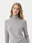 Women's Cashmere Turtleneck Sweater High Rise worn by model, detail view on white background