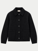 A black wool-blend jacket with a pointed collar, dark buttons, and two front patch pockets, shown flat against a light gray background. A small interior neck label reads GOBI
