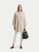 Women's Beige Cashmere Button-Front Poncho worn by model, front view on white background