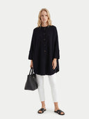 Women's Black Cashmere Button-Front Poncho  worn by model, front view on white background