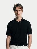 Men's Black Cashmere Silk Half-Zip Polo Top worn by model, detail view on white background