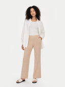Women's Beige Cashmere Cashmere Pants worn by model, front view on white background