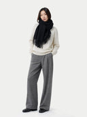 Wide Fringe Scarf Black worn by model, detail view on white background #color_black