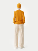 € 99 Cashmere Hat & Sweater Set Daffodil  worn by model, back view on white background
