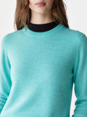 Women's Holiday Blue Cashmere Crewneck Sweater worn by model, detail view on white background 