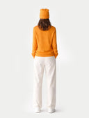 € 99 Cashmere Hat & Sweater Set Apricot worn by model, back view on white background