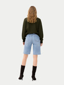 Women's T-Neck Organic Colour Cashmere Sweater Avocado worn by model, back view on white background