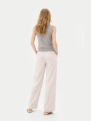 Timeless Cashmere Crewneck Vest Dawn Blue worn by model, back view, on white background
