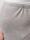 Close-up of gray sweatpants with a white shirt underneath