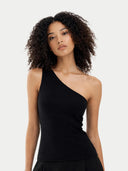 Woman wearing a black one-shoulder cashmere top against a white background #color_black